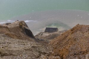 Water gushes into the Berkeley Pit after a hail storm at the Berkeley Pit viewing stand in Butte on July 16. Photo Credit: Megan Nielsen, Montana Standard