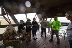 Mark Mariano, waterfowl protection specialist for Fairweather IT and AppSciTec, gives a presentation on the migratory waterfowl protection program at the Berkeley Pit viewing stand in Butte on July 16. Photo Credit: Megan Nielsen, Montana Standard