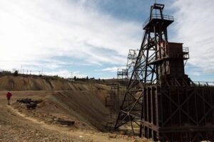 An attendee walks along the edge by the Granite Mountain Mine headframe during a tour led by CTEC to the historic Pilot Butte Mine in Butte on Thursday. MEGAN NIELSEN, Montana Standard